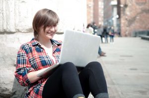 woman outside on laptop