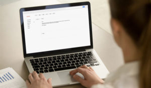 woman typing up an email