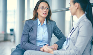 two women talking to each other