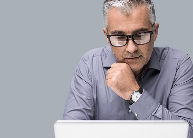 man looking at laptop