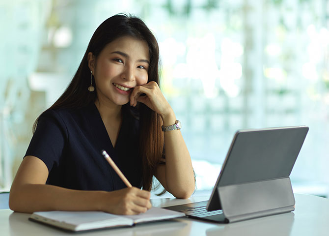 woman with paper and tablet