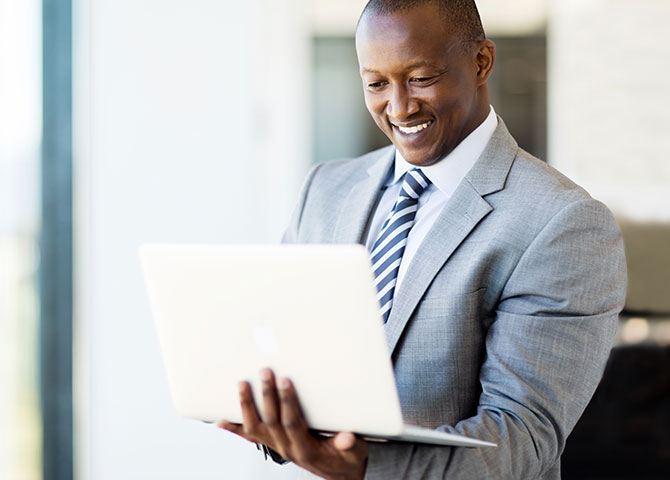 man typing on laptop